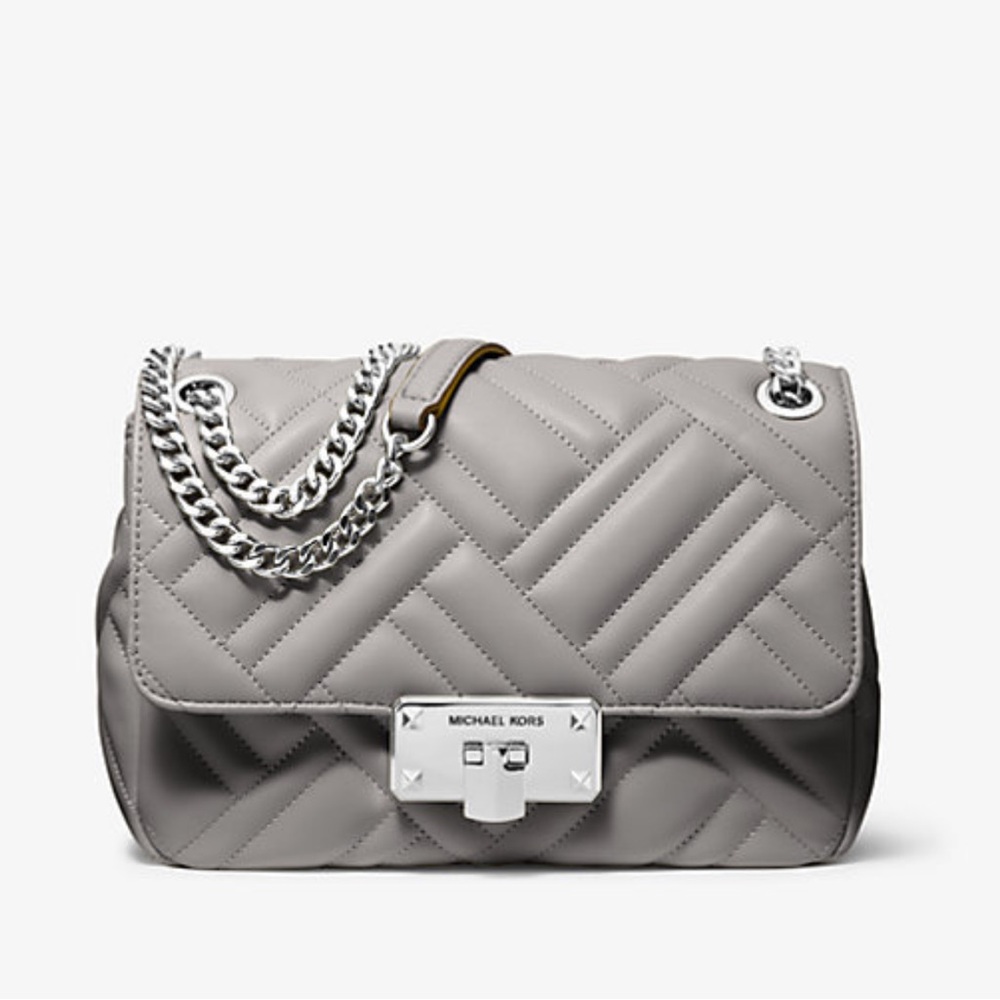 Michael Kors  Medium Quilted Peyton Shoulder Bag in Gray with silver hardware.